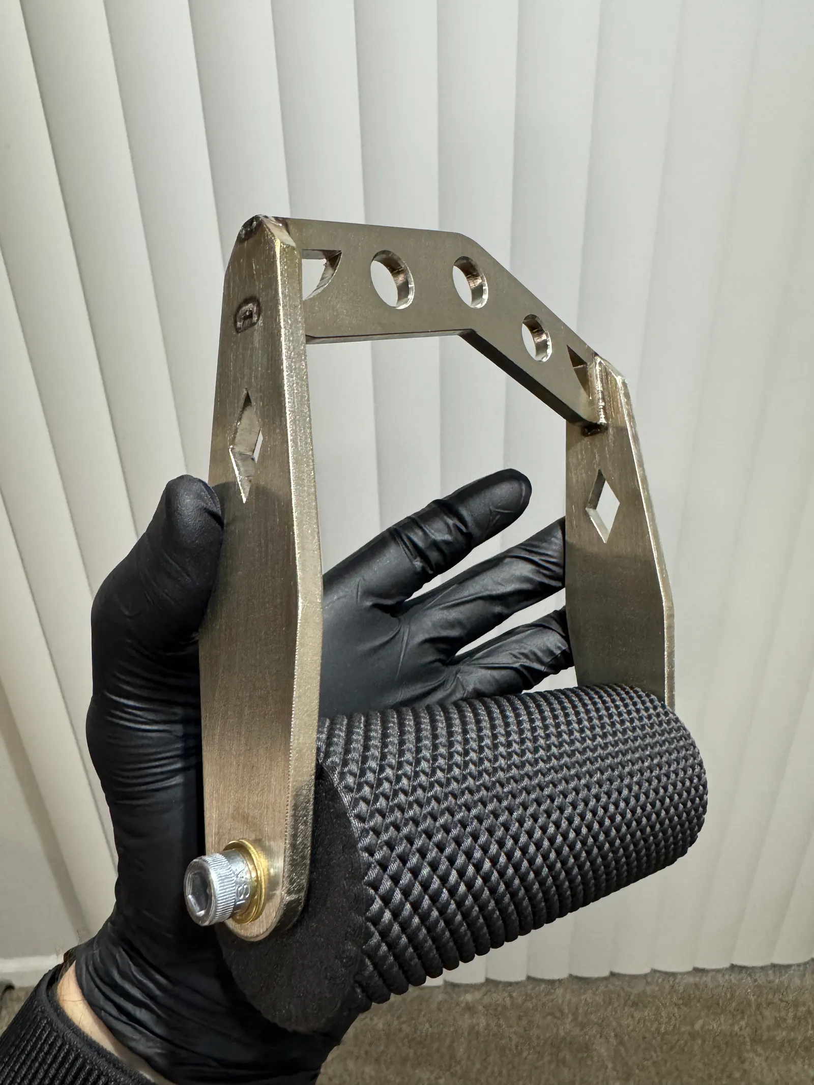 Custom fabricated metal handle with a textured grip